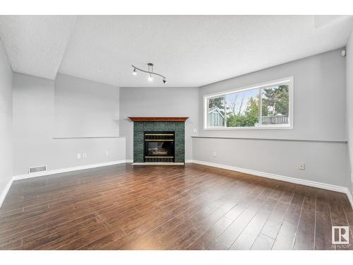 12803 145 Av Nw Nw, Edmonton, AB - Indoor Photo Showing Living Room With Fireplace