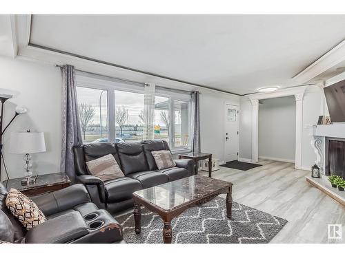 9304/08 127 Av Nw, Edmonton, AB - Indoor Photo Showing Living Room With Fireplace