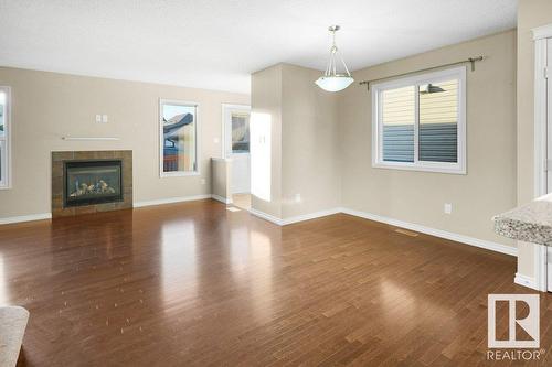 582 Tamarack Rd Nw Nw, Edmonton, AB - Indoor Photo Showing Other Room With Fireplace