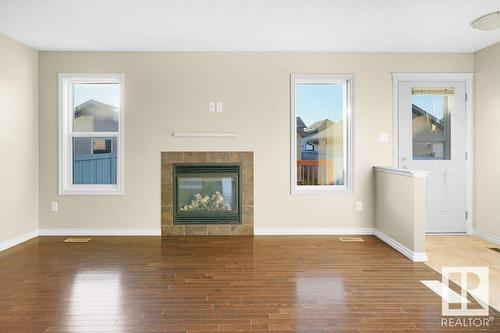 582 Tamarack Rd Nw Nw, Edmonton, AB - Indoor Photo Showing Living Room With Fireplace