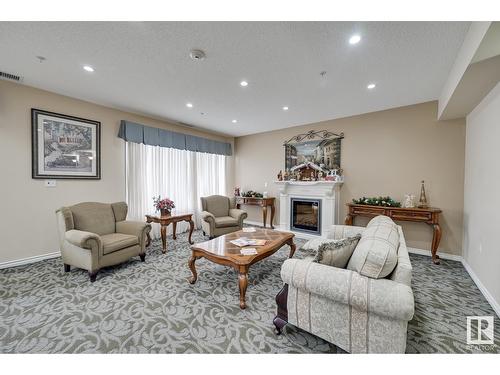 9820 165 St Nw, Edmonton, AB - Indoor Photo Showing Living Room With Fireplace