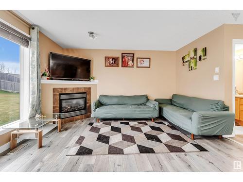 3723 11 St Nw, Edmonton, AB - Indoor Photo Showing Living Room With Fireplace