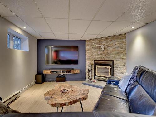 Family room - 55  - 57 Rue Du Domaine, Lavaltrie, QC - Indoor Photo Showing Other Room With Fireplace