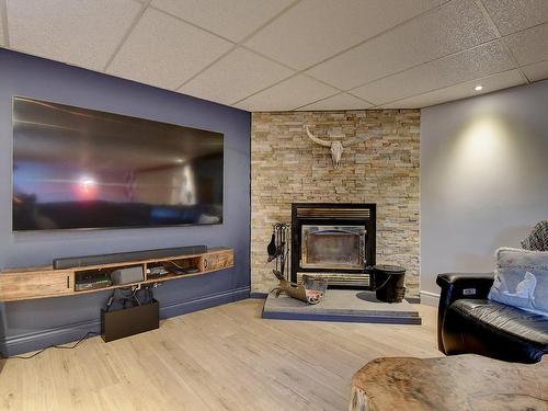 Family room - 55  - 57 Rue Du Domaine, Lavaltrie, QC - Indoor With Fireplace