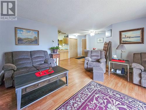 303 360 Cypress Drive, Swift Current, SK - Indoor Photo Showing Living Room