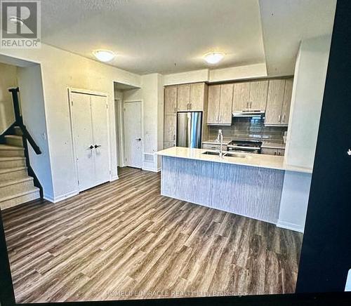 322 - 130 Honeycrisp Crescent, Vaughan, ON - Indoor Photo Showing Kitchen With Stainless Steel Kitchen