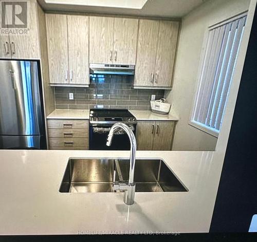 322 - 130 Honeycrisp Crescent, Vaughan, ON - Indoor Photo Showing Kitchen With Stainless Steel Kitchen With Double Sink