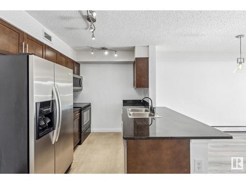 #303 11816 22 Av Sw, Edmonton, AB - Indoor Photo Showing Kitchen With Double Sink