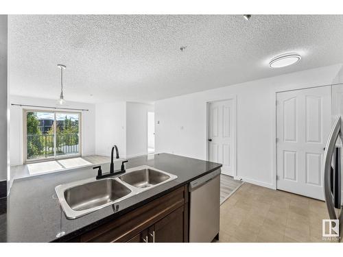 #303 11816 22 Av Sw, Edmonton, AB - Indoor Photo Showing Kitchen With Double Sink