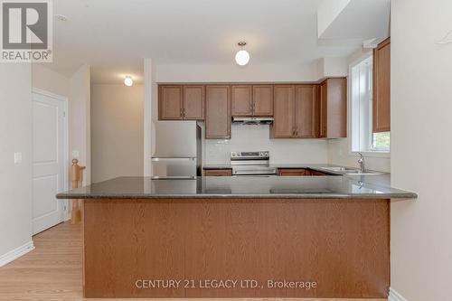 308 - 10 Halliford Place, Brampton, ON - Indoor Photo Showing Kitchen With Double Sink