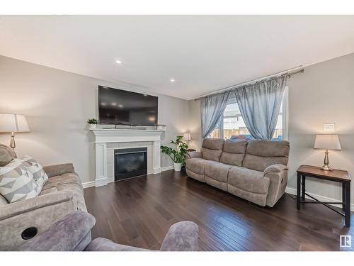 1204 24 Av Nw, Edmonton, AB - Indoor Photo Showing Living Room With Fireplace