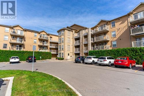 213 - 1480 Bishops Gate, Oakville, ON - Outdoor With Balcony With Facade