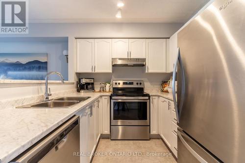 213 - 1480 Bishops Gate, Oakville, ON - Indoor Photo Showing Kitchen With Stainless Steel Kitchen With Double Sink