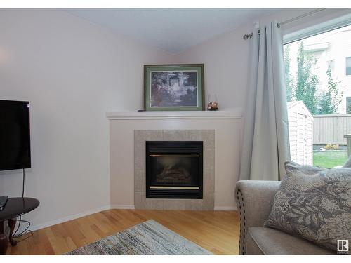 9144 165 Av Nw, Edmonton, AB - Indoor Photo Showing Living Room With Fireplace