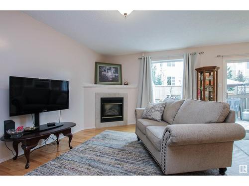 9144 165 Av Nw, Edmonton, AB - Indoor Photo Showing Living Room With Fireplace