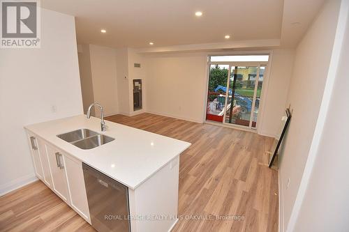 219 - 1936 Rymal Road E, Hamilton, ON - Indoor Photo Showing Kitchen With Double Sink