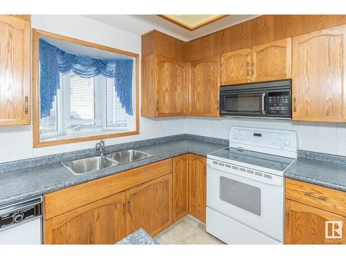 12423 56 St Nw, Edmonton, AB - Indoor Photo Showing Kitchen With Double Sink