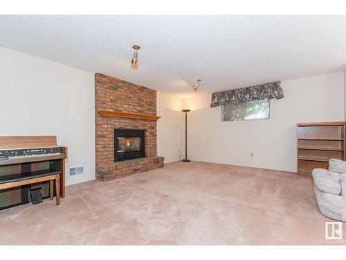 12423 56 St Nw, Edmonton, AB - Indoor Photo Showing Living Room With Fireplace