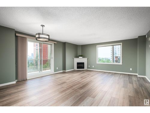 #703 9741 110 St Nw, Edmonton, AB - Indoor Photo Showing Living Room With Fireplace