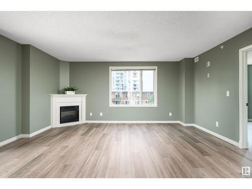 #703 9741 110 St Nw, Edmonton, AB - Indoor Photo Showing Living Room With Fireplace