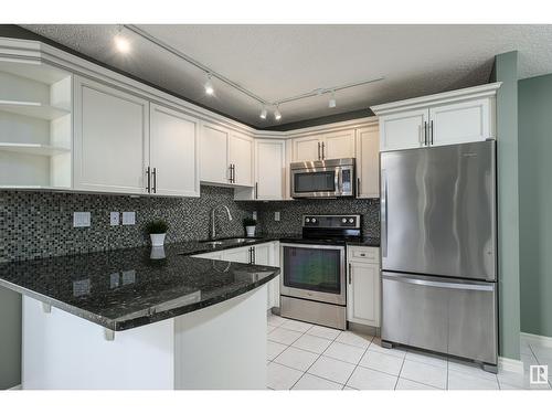 #703 9741 110 St Nw, Edmonton, AB - Indoor Photo Showing Kitchen With Stainless Steel Kitchen