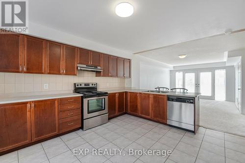 145 - 3050 Erin Centre Boulevard, Mississauga, ON - Indoor Photo Showing Kitchen With Double Sink