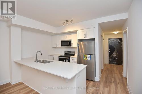 221 - 1936 Rymal Road E, Hamilton, ON - Indoor Photo Showing Kitchen With Stainless Steel Kitchen With Double Sink