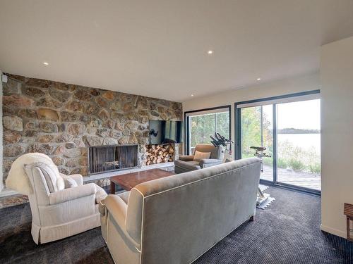 Family room - 20 Av. D'Amiens, Estérel, QC - Indoor Photo Showing Living Room With Fireplace