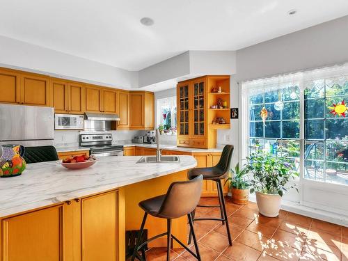 Coin-repas - 104 Ch. Du Roi, Saint-Colomban, QC - Indoor Photo Showing Kitchen With Double Sink