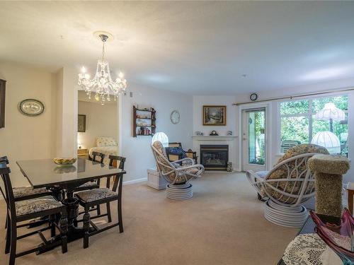 103-2777 Barry Rd, Mill Bay, BC - Indoor Photo Showing Dining Room With Fireplace