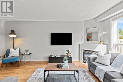 12 - 134 Terni Boulevard, Hamilton, ON - Indoor Photo Showing Living Room With Fireplace