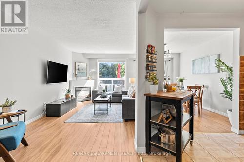 12 - 134 Terni Boulevard, Hamilton, ON - Indoor Photo Showing Living Room With Fireplace