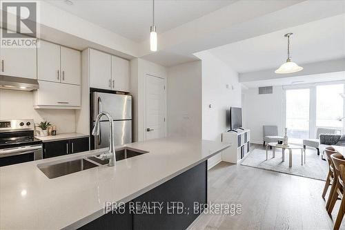 111 - 3028 Creekshore Common, Oakville, ON - Indoor Photo Showing Kitchen With Double Sink With Upgraded Kitchen