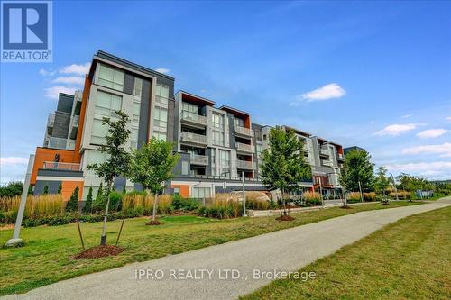 111 - 3028 Creekshore Common, Oakville, ON - Outdoor With Facade