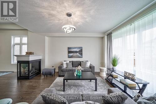 6 Morley Crescent, Whitby, ON - Indoor Photo Showing Living Room With Fireplace