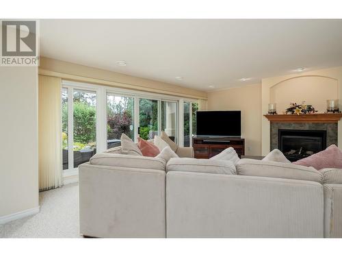 3973 Gallaghers Circle, Kelowna, BC - Indoor Photo Showing Living Room With Fireplace