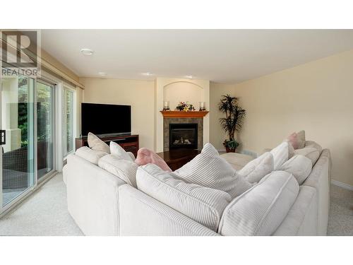 3973 Gallaghers Circle, Kelowna, BC - Indoor Photo Showing Living Room With Fireplace