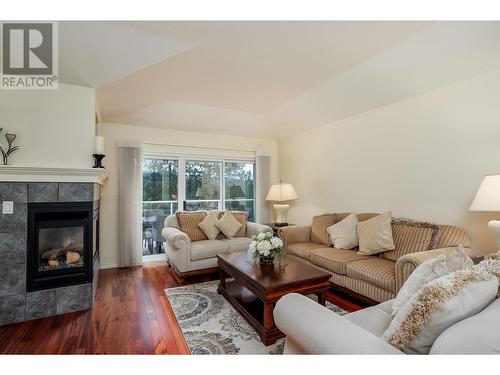 3973 Gallaghers Circle, Kelowna, BC - Indoor Photo Showing Living Room With Fireplace