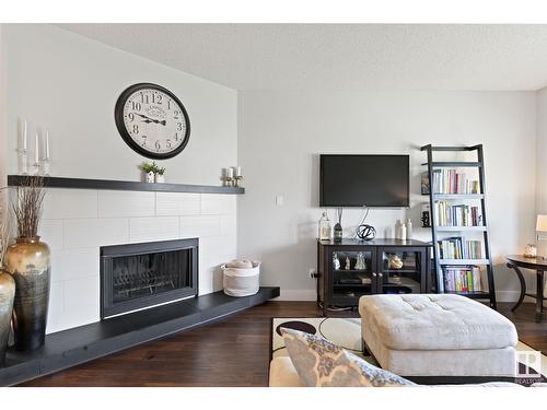 4347 147 St Nw, Edmonton, AB - Indoor Photo Showing Living Room With Fireplace