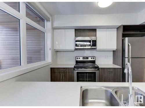 #201 10227 115 St Nw, Edmonton, AB - Indoor Photo Showing Kitchen With Stainless Steel Kitchen With Double Sink