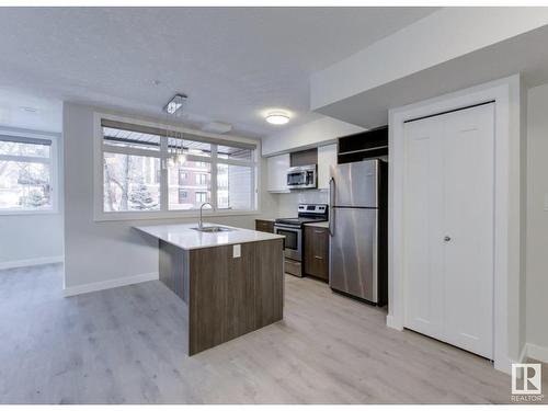 #201 10227 115 St Nw, Edmonton, AB - Indoor Photo Showing Kitchen With Stainless Steel Kitchen