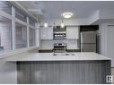 #201 10227 115 St Nw, Edmonton, AB  - Indoor Photo Showing Kitchen With Double Sink With Upgraded Kitchen 