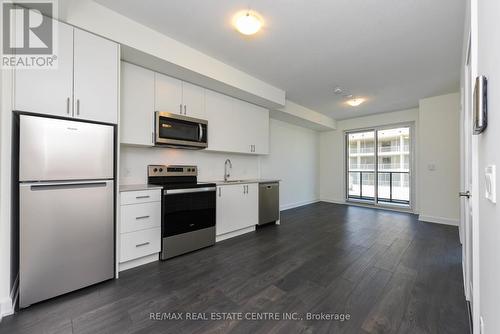 1112 - 3220 William Coltson Avenue, Oakville, ON - Indoor Photo Showing Kitchen With Stainless Steel Kitchen