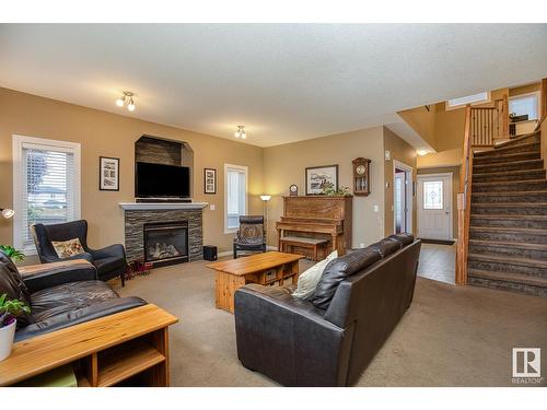 16532 61 St Nw, Edmonton, AB - Indoor Photo Showing Living Room With Fireplace