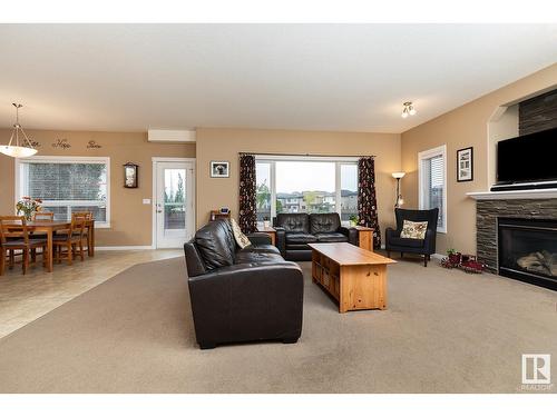 16532 61 St Nw, Edmonton, AB - Indoor Photo Showing Living Room With Fireplace