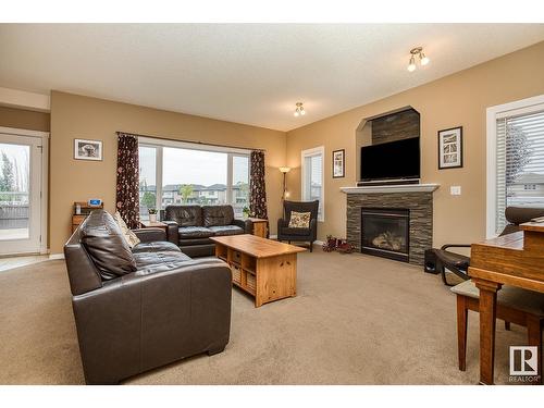 16532 61 St Nw, Edmonton, AB - Indoor Photo Showing Living Room With Fireplace