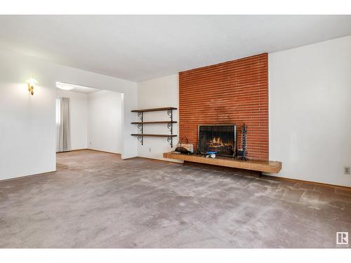 16102 87A Av Nw, Edmonton, AB - Indoor Photo Showing Living Room With Fireplace