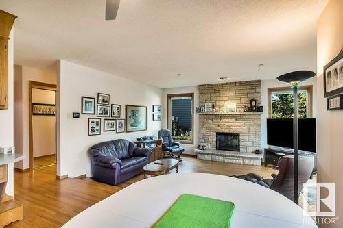 10706 33A Av Nw, Edmonton, AB - Indoor Photo Showing Living Room With Fireplace