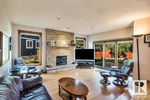 10706 33A Av Nw, Edmonton, AB - Indoor Photo Showing Living Room With Fireplace