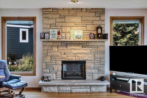 10706 33A Av Nw, Edmonton, AB - Indoor Photo Showing Living Room With Fireplace